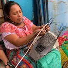 Weaving a plastic basket in rural Guatemala