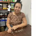 Crafting moon flower earrings in Guatemala
